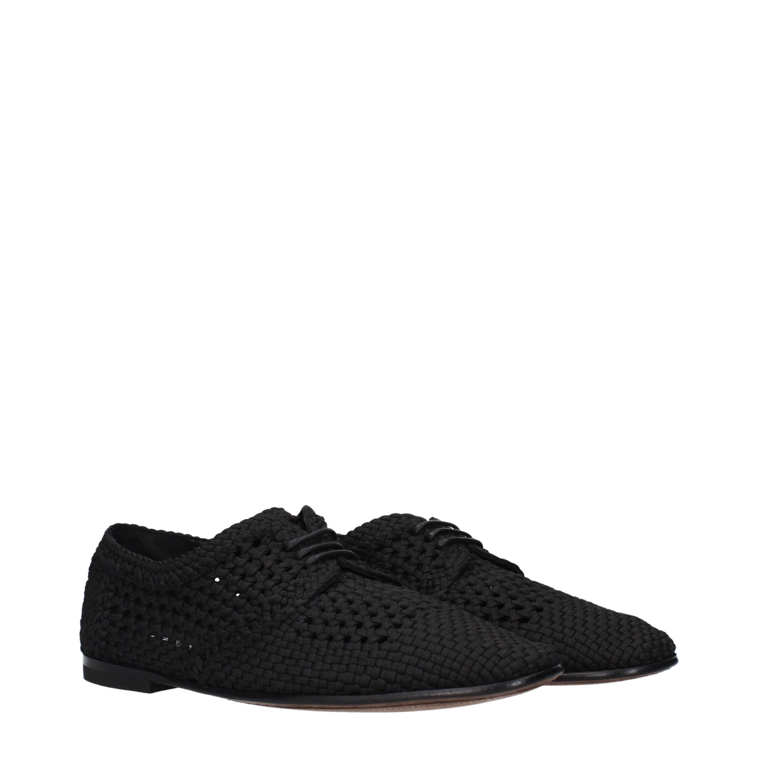 Chaussures Oxford et Derby en tissu noir de Dolce & Gabbana, élégantes et sophistiquées, visibles en gros plan.