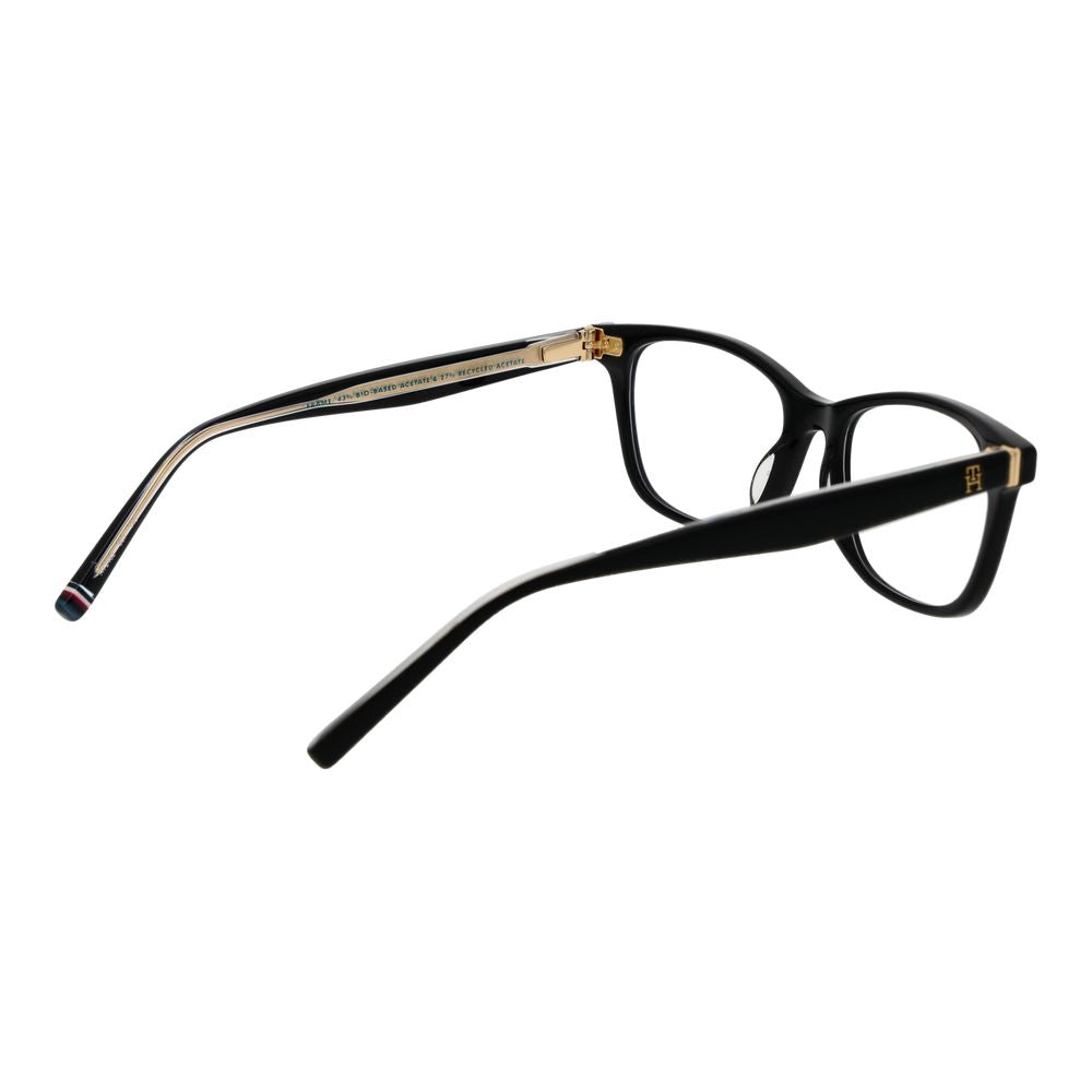 Lunettes en acétate noires Tommy Hilfiger avec monture élégante et moderne, visibles en gros plan dans l'image.