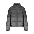 Veste pour femme Tommy Hilfiger en polyester noire, coupe élégante et moderne, avec détails de marque visibles.