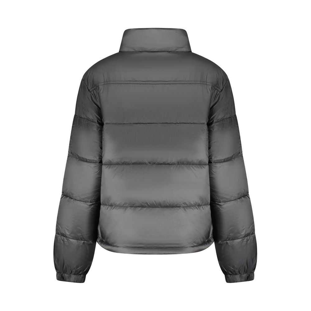 Veste pour femme Tommy Hilfiger en polyester noir, coupe élégante et moderne, avec détails de style distinctifs.