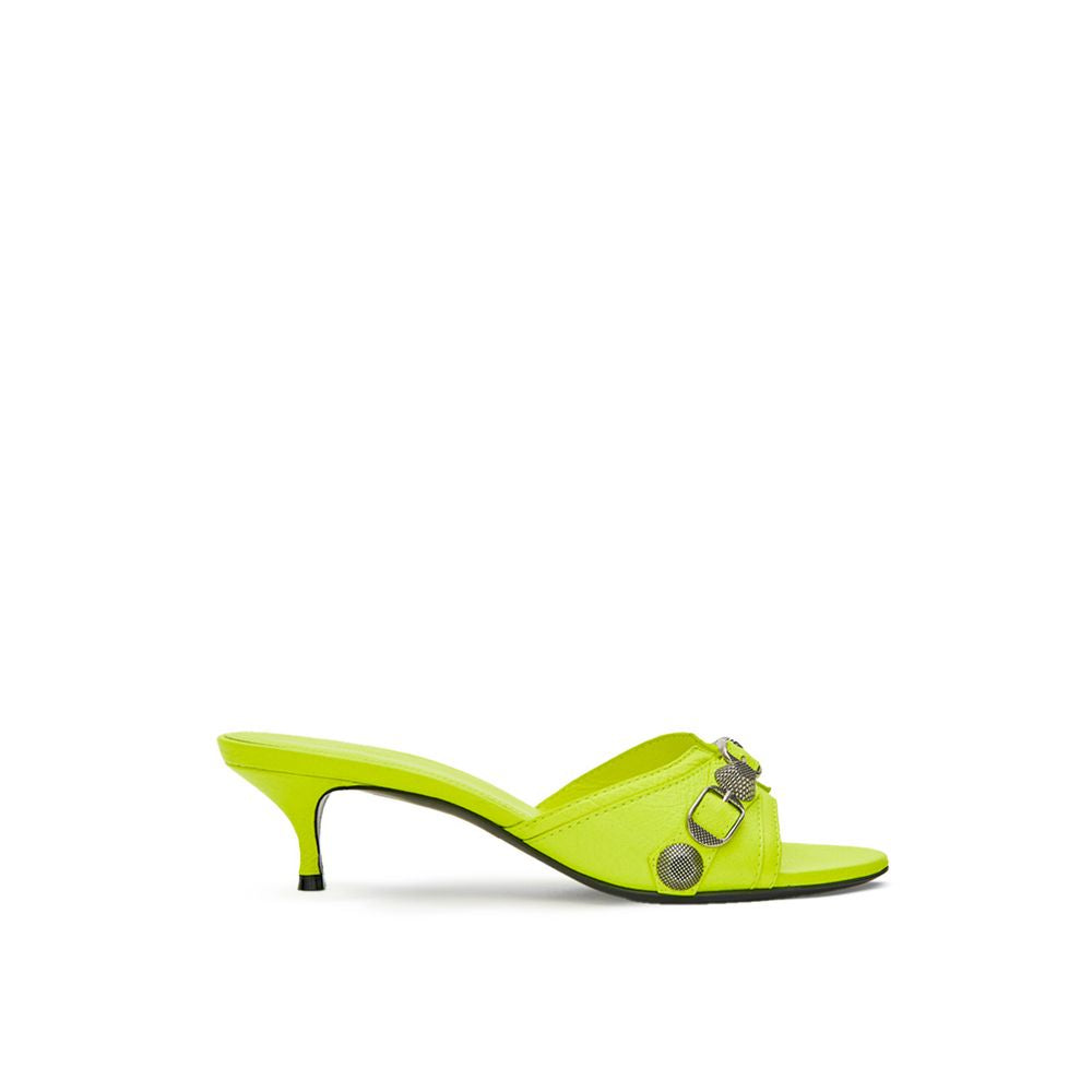 Mules en cuir jaune Balenciaga avec semelle plateforme et design élégant, vues de côté sur fond neutre.