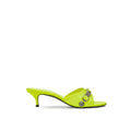 Mules en cuir jaune Balenciaga avec semelle plateforme et design élégant, vues de côté sur fond neutre.