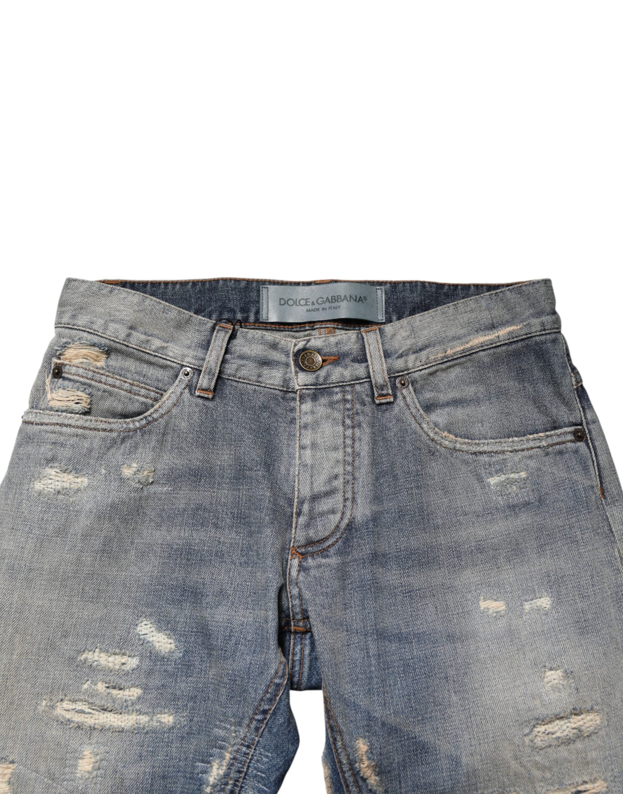 Jean skinny déchiré pour homme Dolce & Gabbana, pantalon en denim bleu avec détails usés et style moderne.