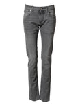 Jeans skinny en coton gris de taille moyenne Dolce & Gabbana, coupe ajustée et détail denim sur fond neutre.