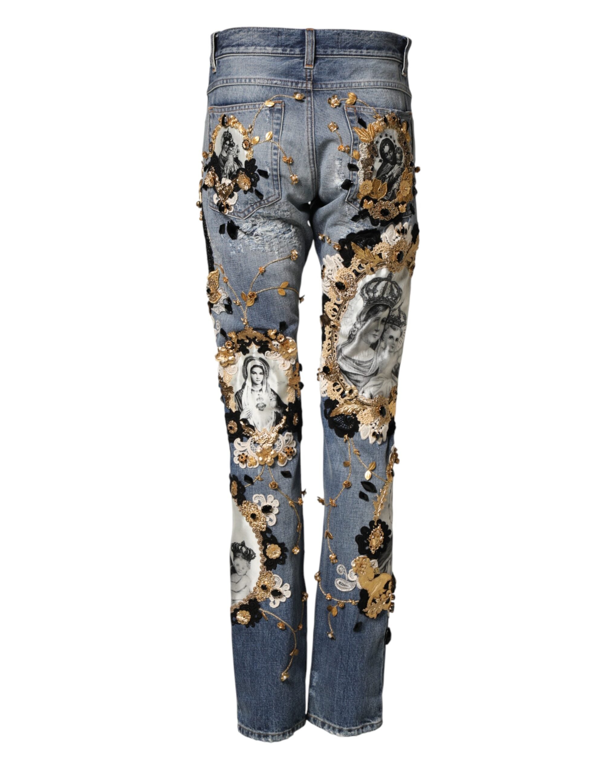 Jean en denim en coton bleu Dolce & Gabbana avec déchirures et embellissements, mode élégante et décontractée.