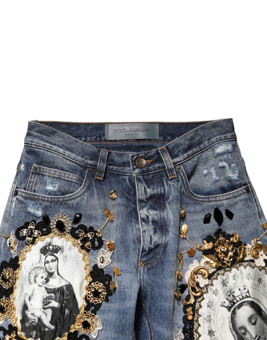 Jeans en denim coton bleu Dolce & Gabbana avec déchirures et embellissements, mode élégante et décontractée.