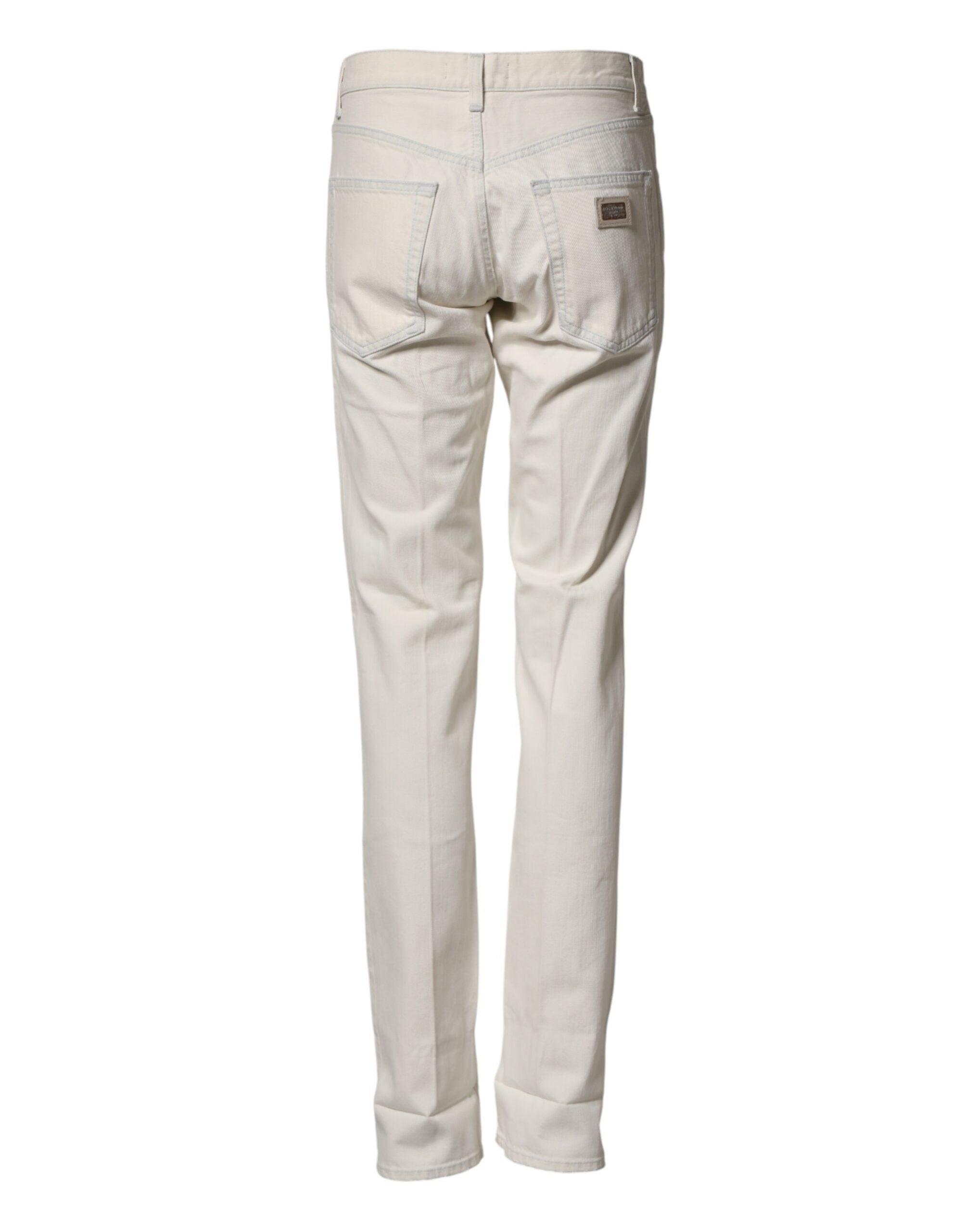 Pantalon homme Dolce & Gabbana en coton blanc, jean skinny en denim, ajusté et moderne, visible sur le mannequin.
