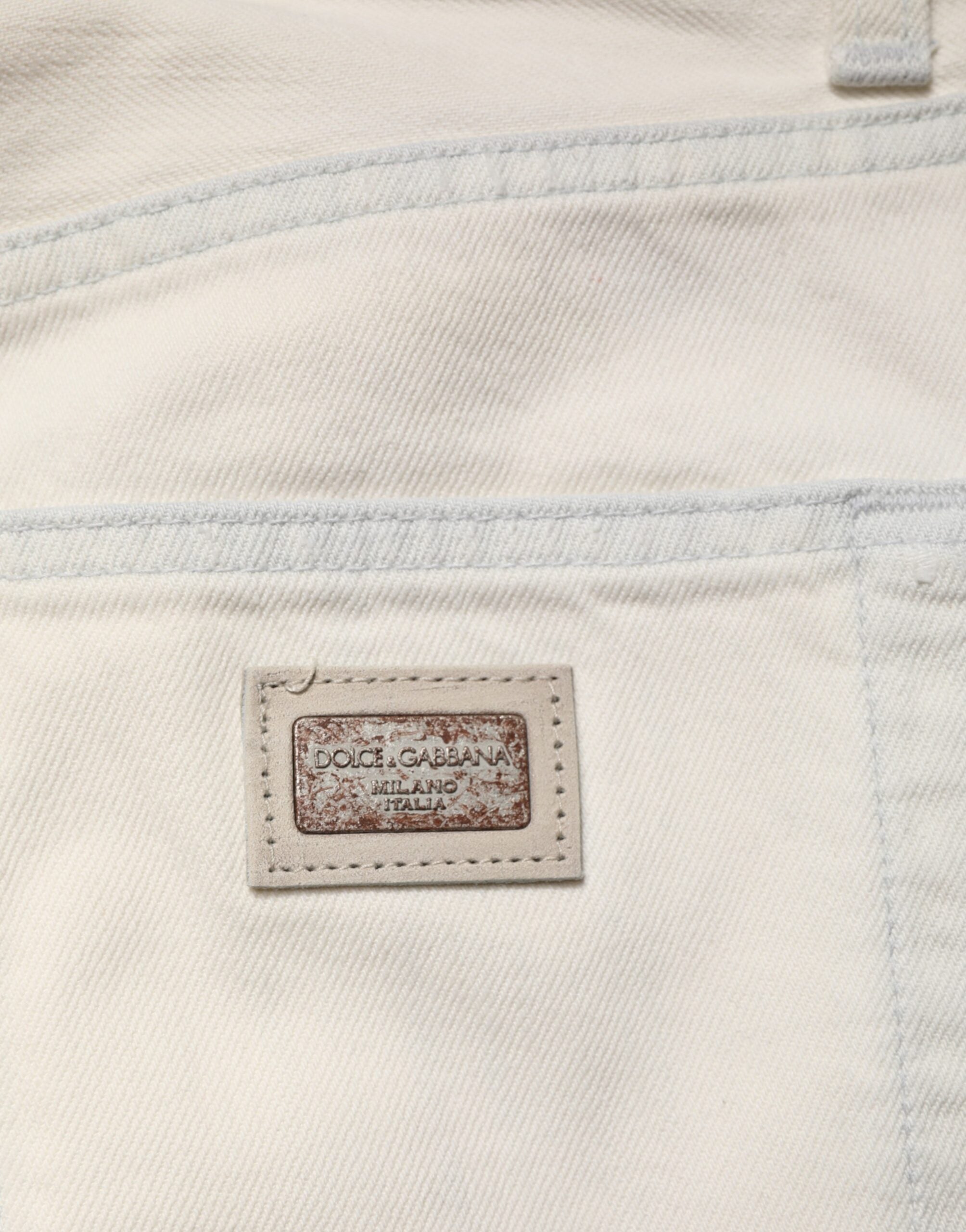 Pantalon homme Dolce & Gabbana en denim blanc, coupe skinny en coton, style slim, visible sur un mannequin.