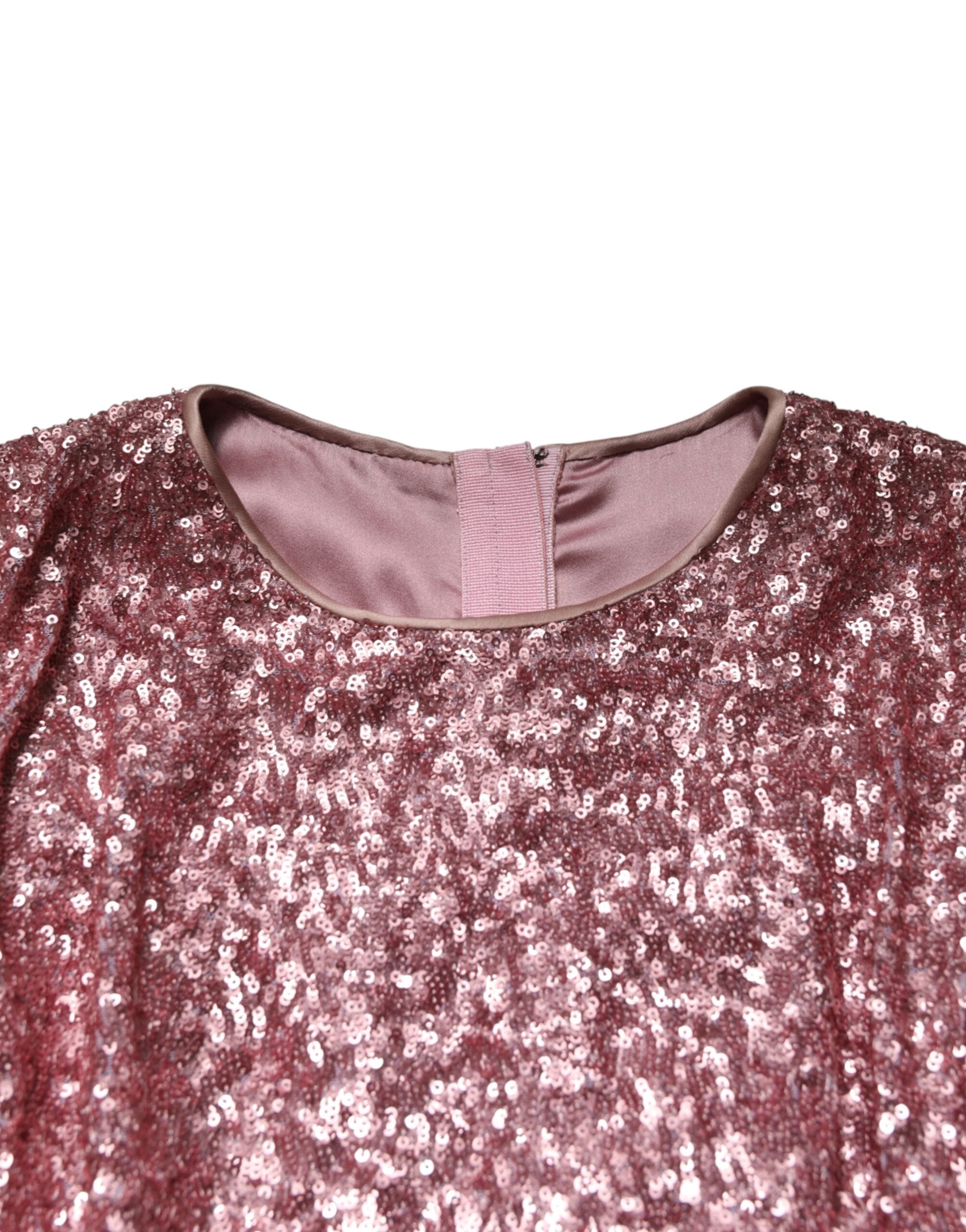 Robe longue sirène Dolce & Gabbana en sequins roses, élégante et brillante, avec décolleté en V et détails sophistiqués.