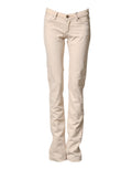 Pantalons en jean slim beige à taille basse en coton de Dolce & Gabbana, coupe ajustée et style décontracté.