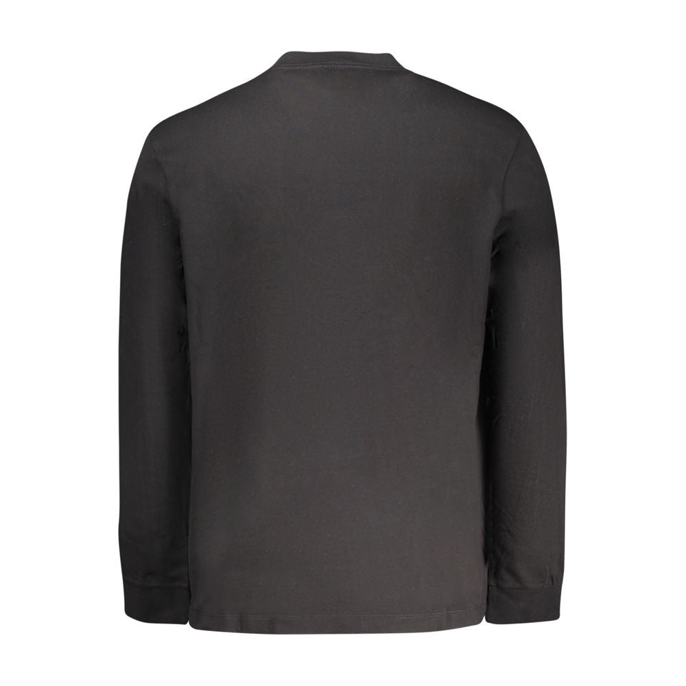 T-shirt homme en coton noir de Calvin Klein, coupe classique, porté sur un mannequin.