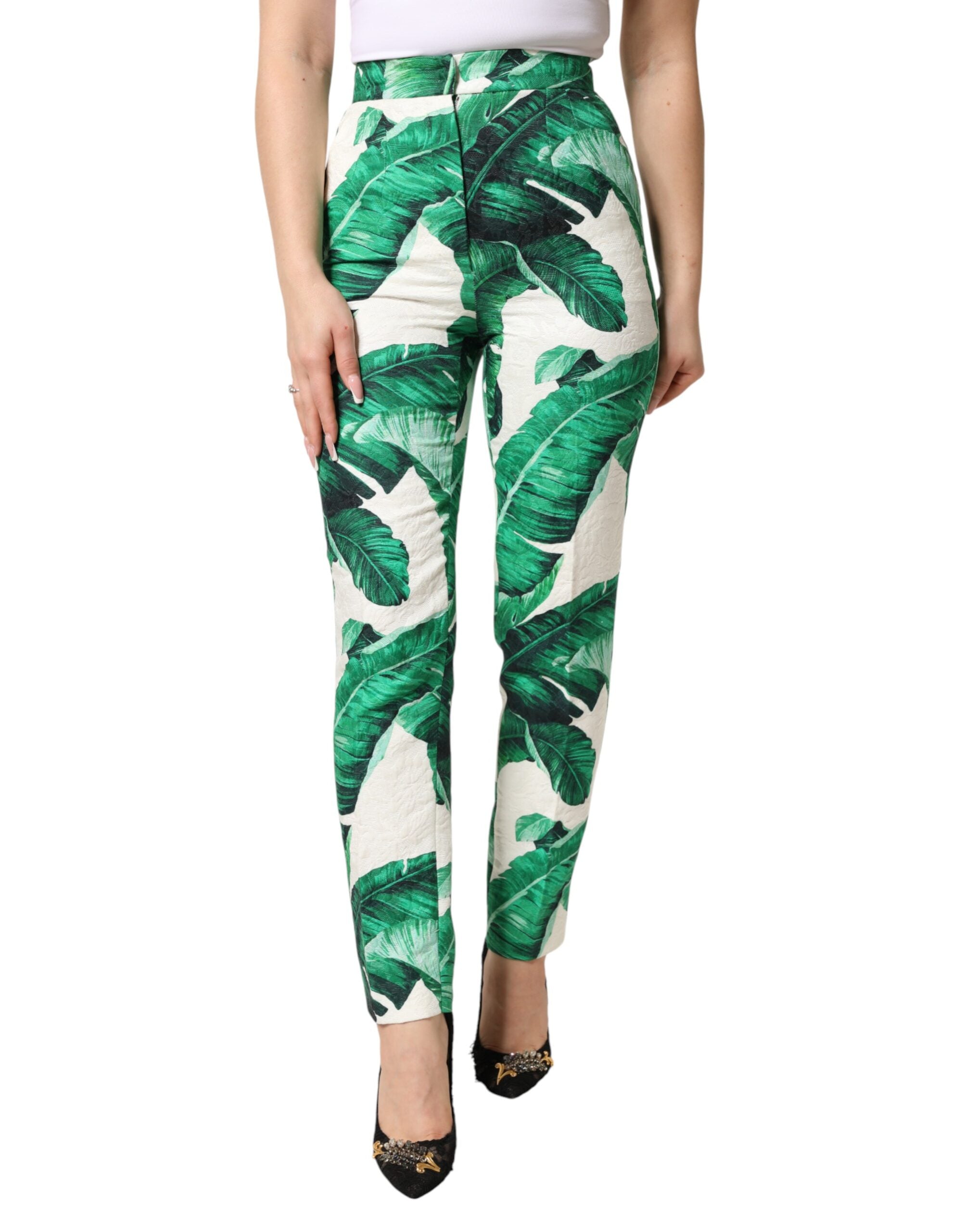 Pantalons Dolce & Gabbana blanc et vert à taille haute avec motif de feuilles, élégant et tendance.