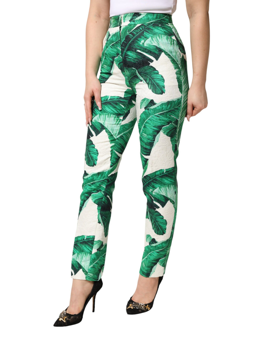 Pantalon blanc à taille haute Dolce & Gabbana avec motif feuillage vert, élégant et tendance.