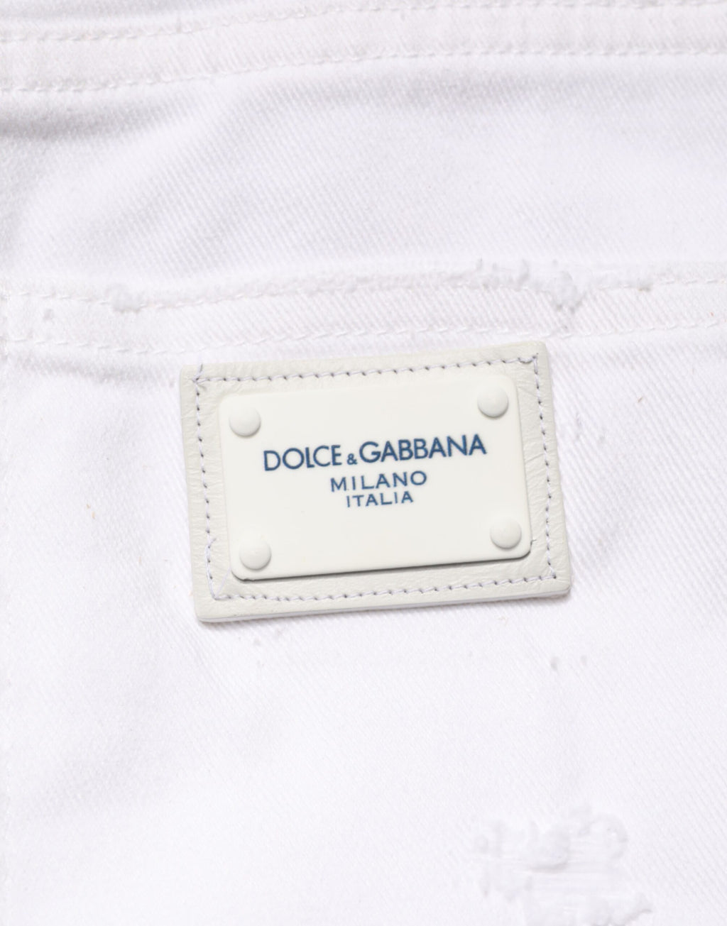 Jeans boyfriend en coton blanc déchiré de Dolce & Gabbana, style décontracté avec détails usés.