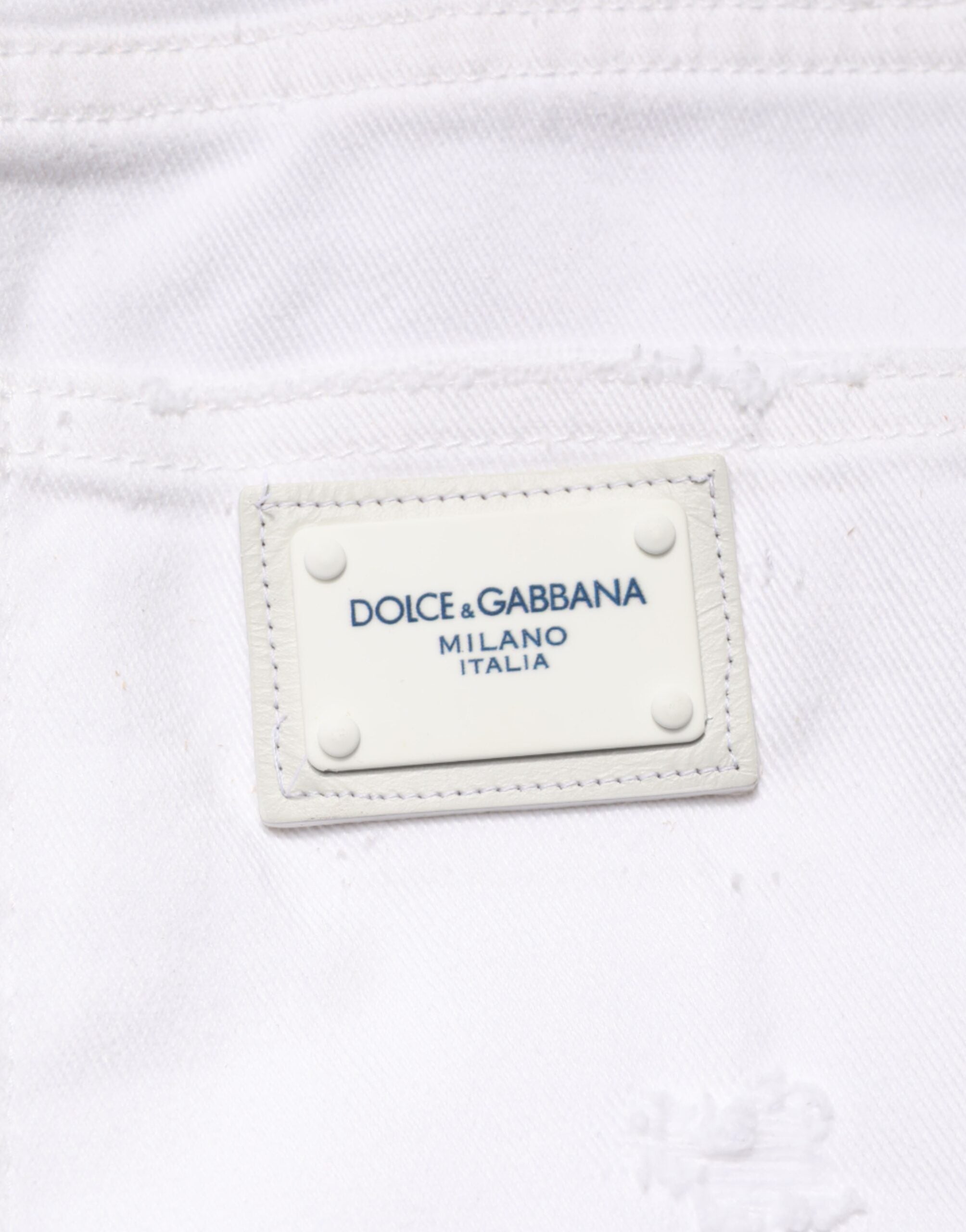Jeans boyfriend en coton blanc déchiré de Dolce & Gabbana, style décontracté avec détails usés.