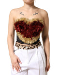 Corset bustier Dolce & Gabbana noir orné de cœurs dorés et paillettes, ajusté avec détails précieux, vue de face.