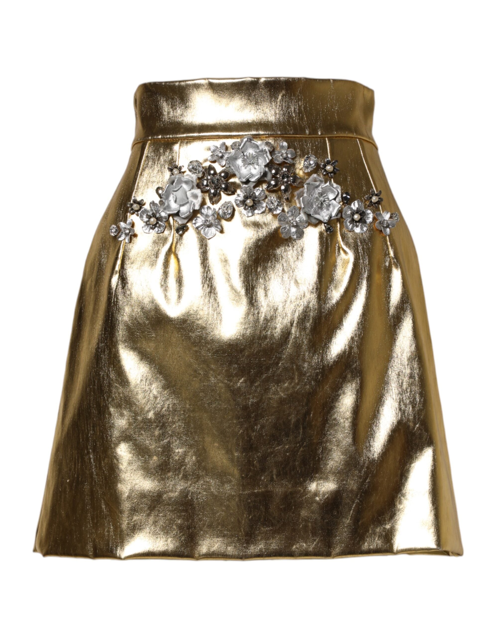 Jupe courte dorée en acétate avec cristaux, haute taille, de la marque Dolce & Gabbana, visible avec détails brillants.