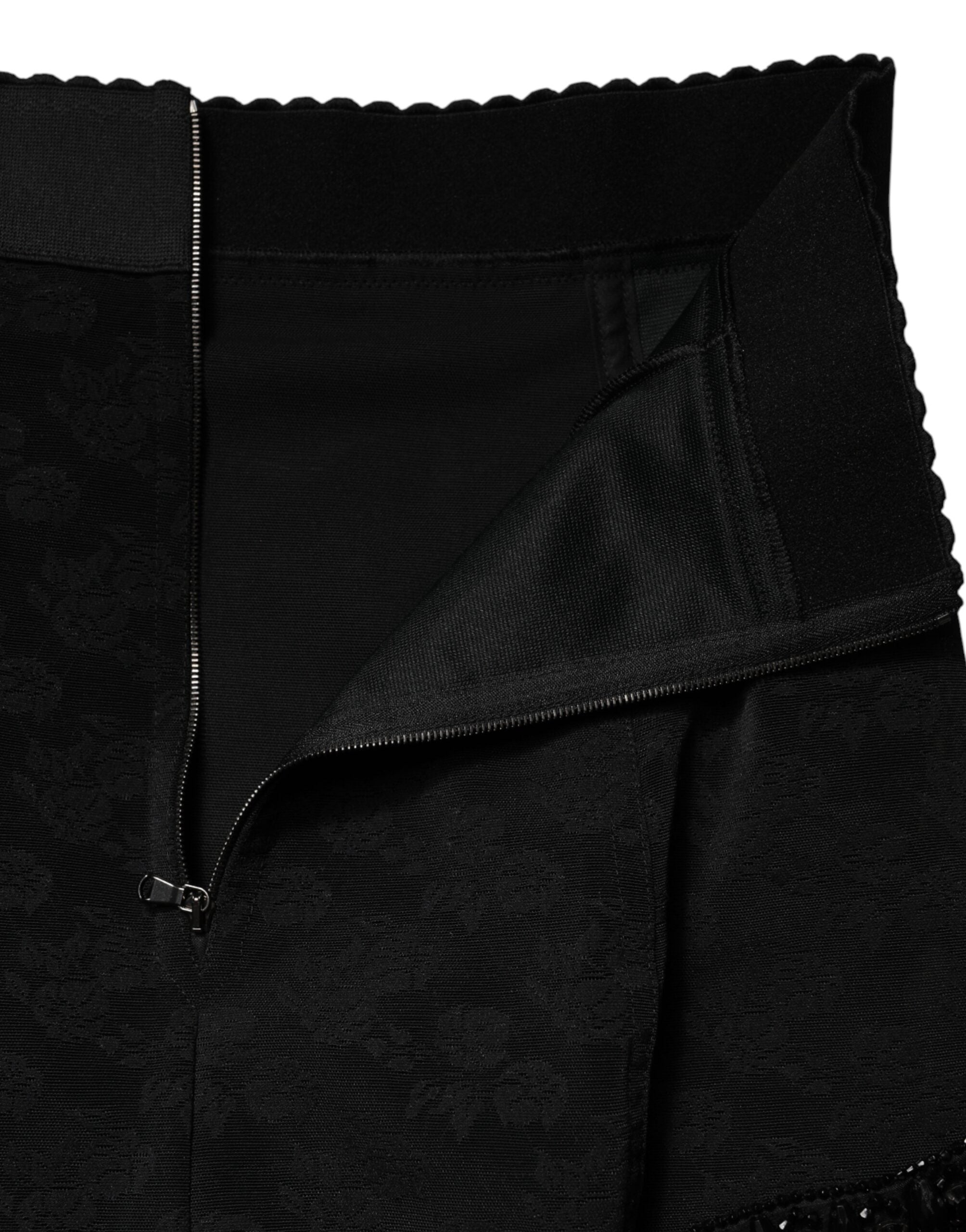 Mini jupe en nylon noir Dolce & Gabbana avec broderies en dentelle et embellissements, ajustée et élégante.