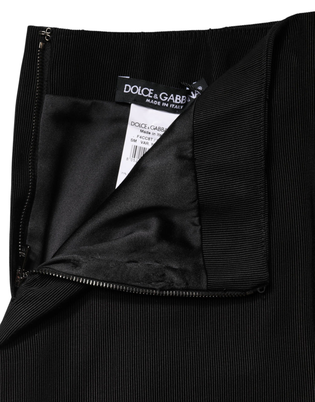 Jupe courte en coton noir Dolce & Gabbana à coupe pencil taille haute, style élégant et moderne.