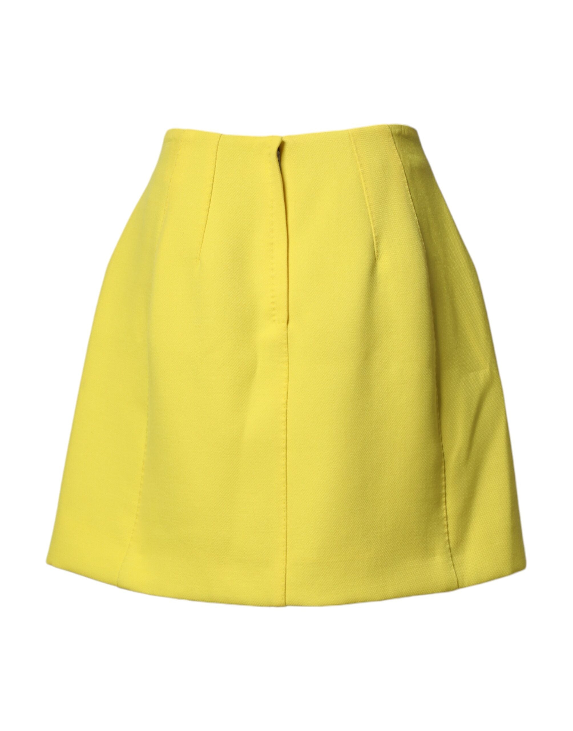 Jupe courte en laine jaune à boutons haute taille de Dolce & Gabbana, vue de face avec détails visibles.