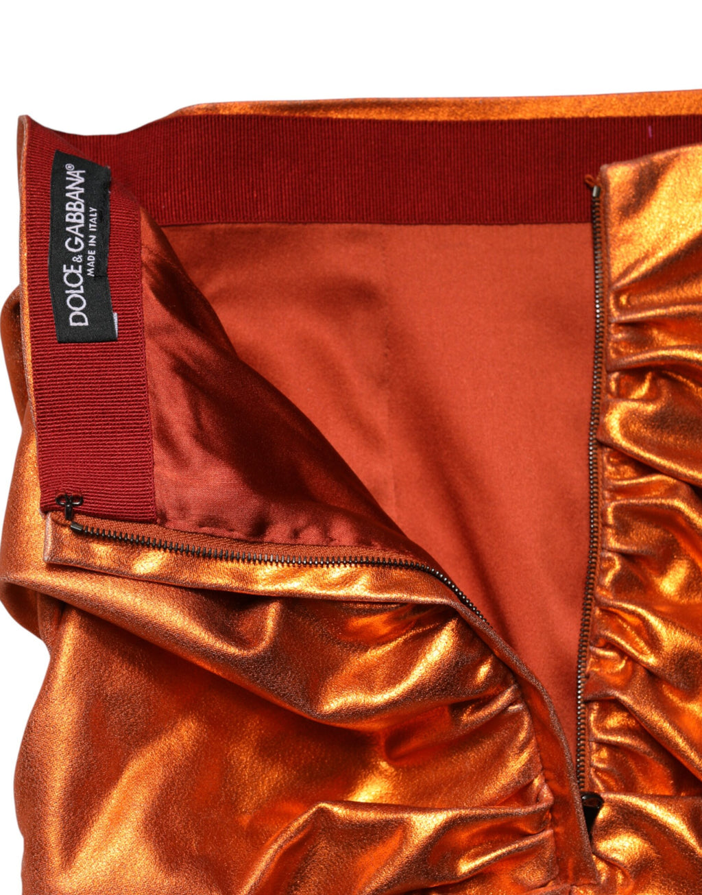 Jupe courte en viscose orange métallisée à taille haute de Dolce & Gabbana, style élégant et moderne.