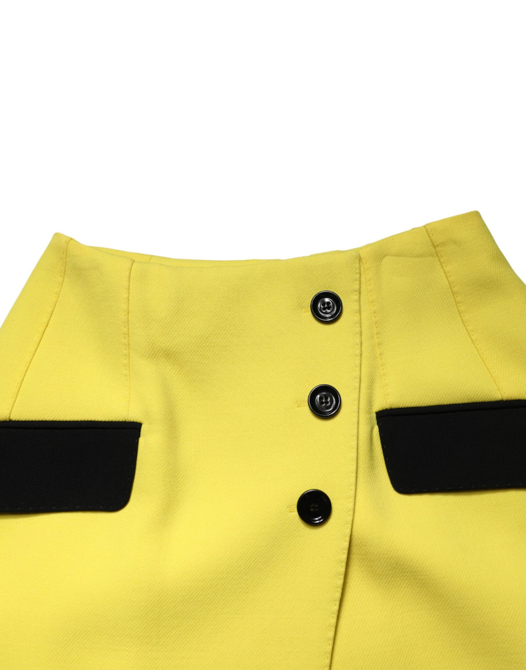 Mini jupe en laine jaune à boutons haute taille de Dolce & Gabbana, vue de face avec détails de la fermeture.