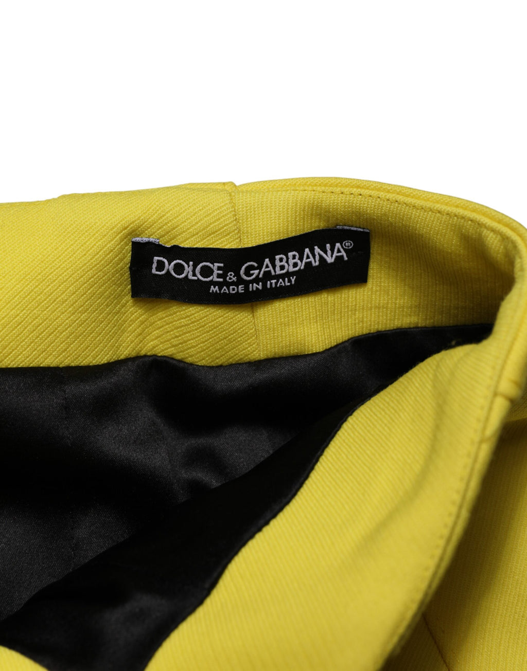 Jupe courte en laine jaune avec boutons haut de gamme Dolce & Gabbana, taille haute et style élégant.
