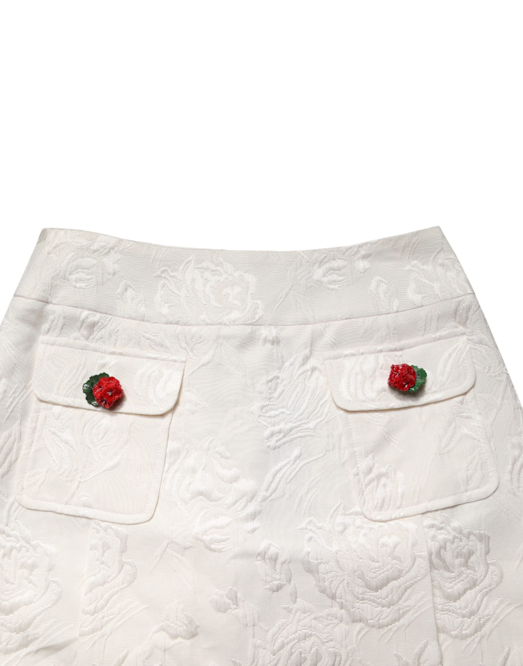 Jupe courte en brocart floral blanche de Dolce & Gabbana, taille haute, style élégant et sophistiqué.