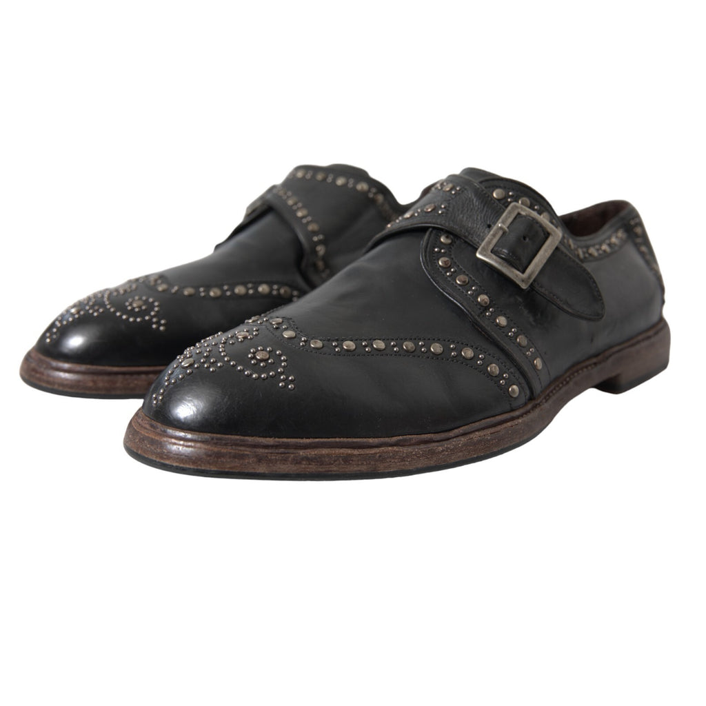 Chaussures de ville en cuir noir Dolce & Gabbana avec bride monk et studs, style élégant et sophistiqué.