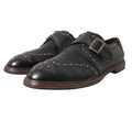 Chaussures de ville en cuir noir Dolce & Gabbana avec bride monk et studs, style élégant et sophistiqué.