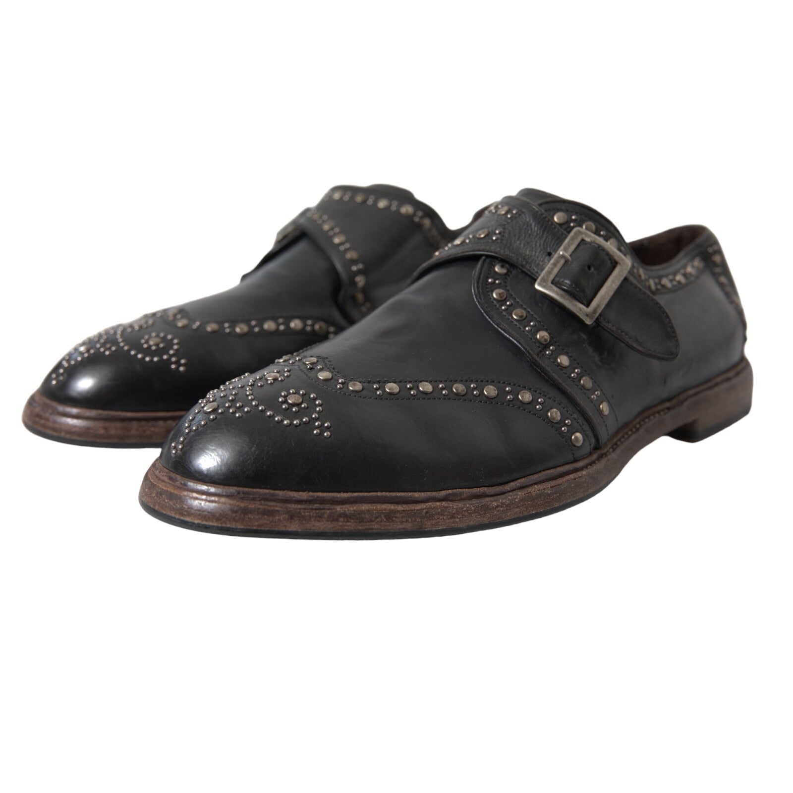 Chaussures de ville en cuir noir Dolce & Gabbana avec bride monk et studs, style élégant et sophistiqué.