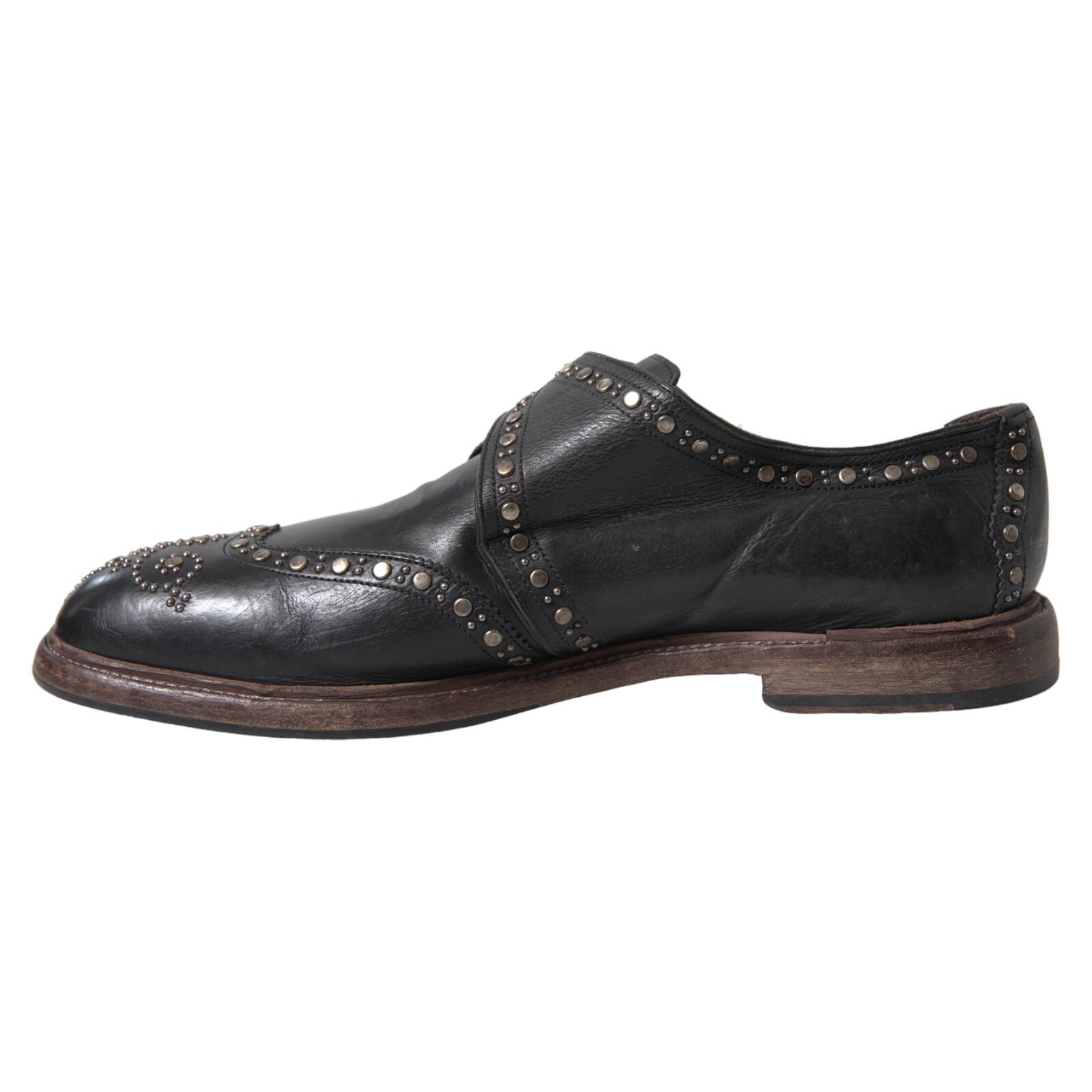 Chaussures habillées en cuir noir Dolce & Gabbana avec bride monk et clous, style élégant pour homme.
