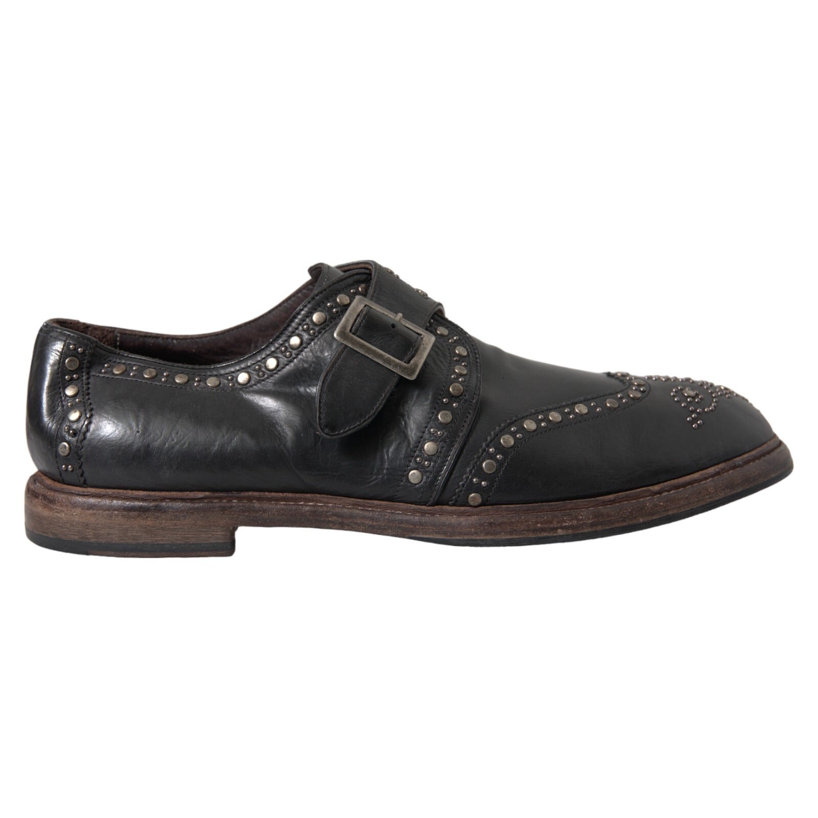 Chaussures habillées en cuir noir Dolce & Gabbana, monk strap avec studs, pour homme élégante et sophistiquée.