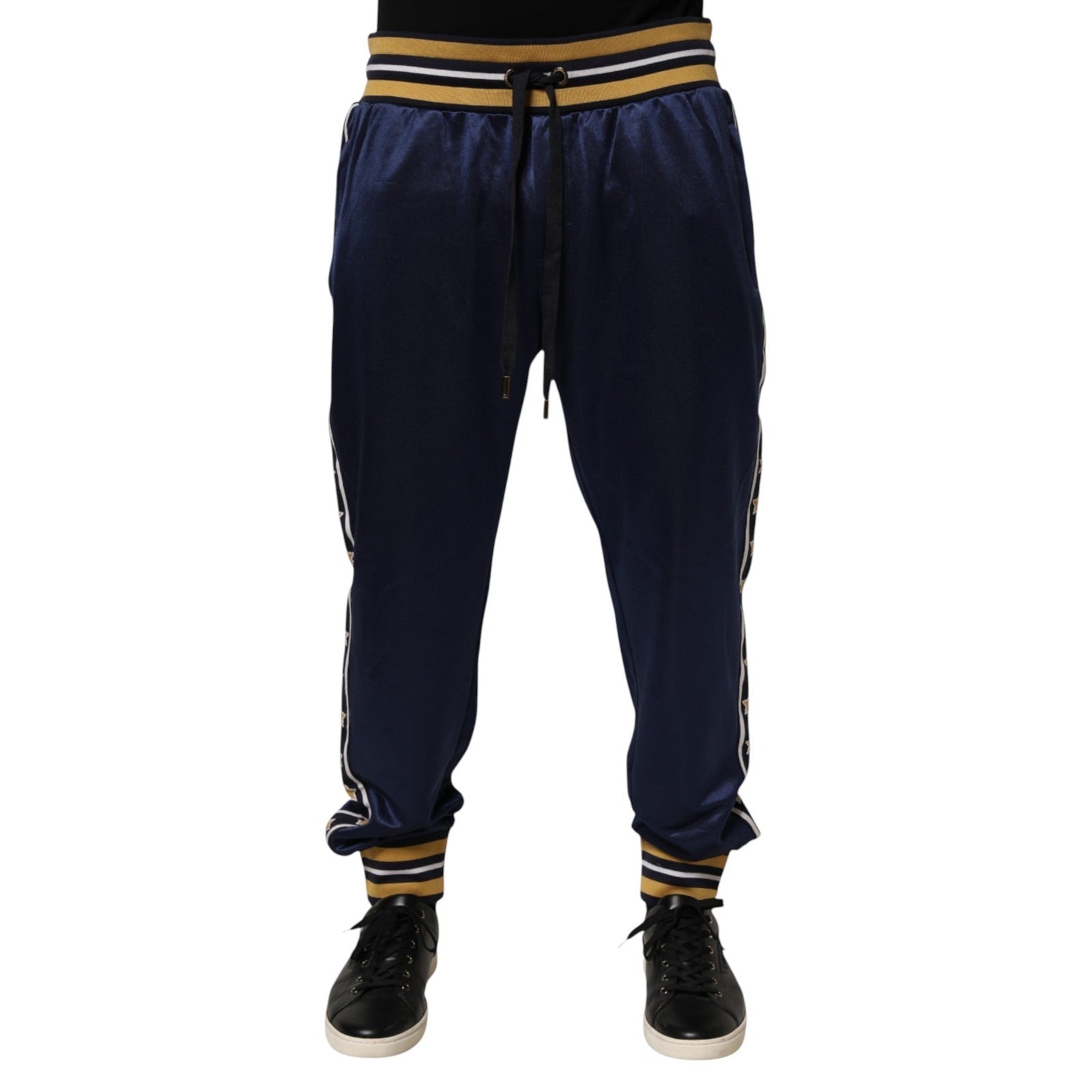 Pantalon jogger en nylon bleu Dolce & Gabbana, taille moyenne, avec ceinture élastique et détails modernes.