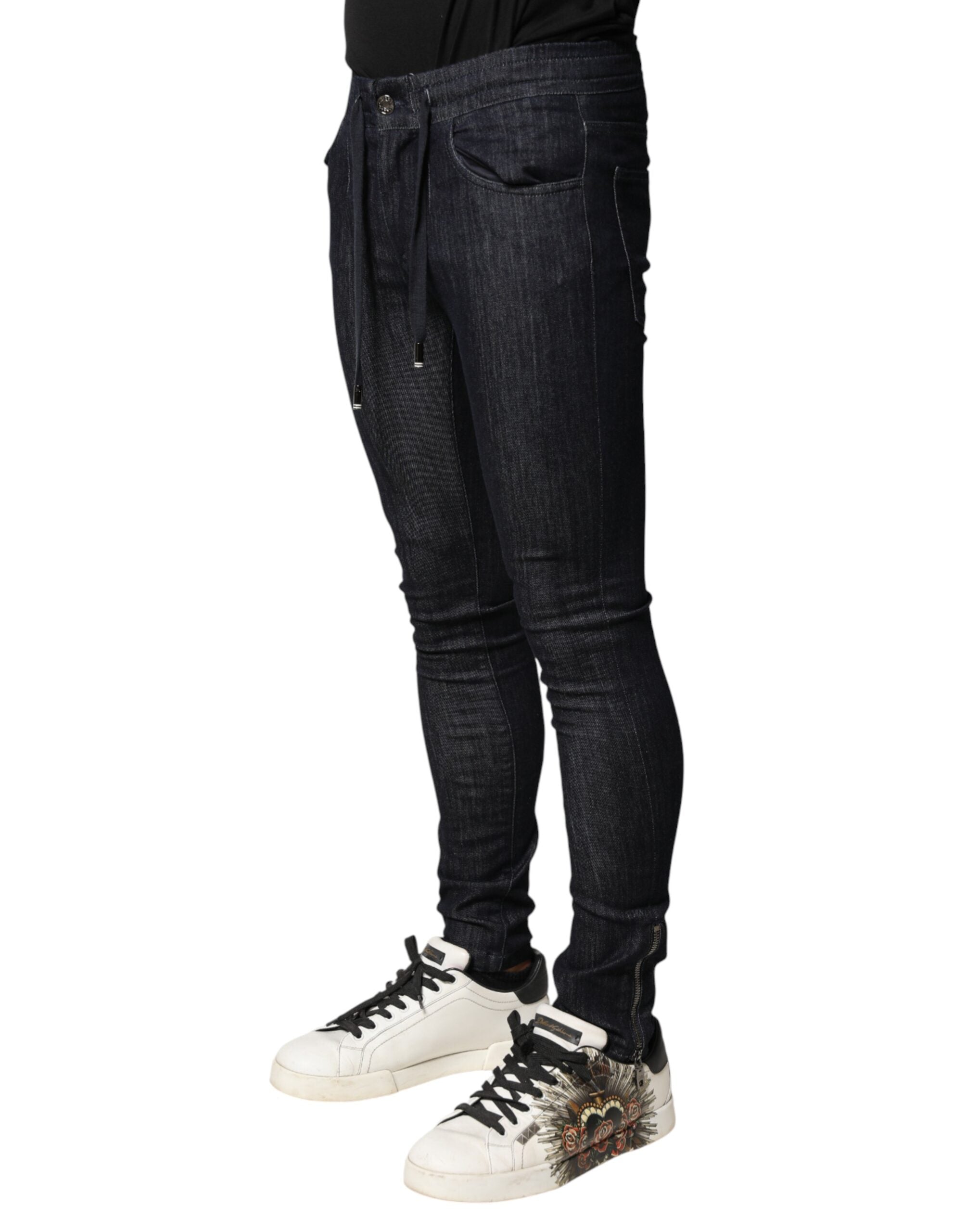 Jeans skinny en coton stretch noir pour homme de Dolce & Gabbana, denim ajusté et tendance visible sur l'image.