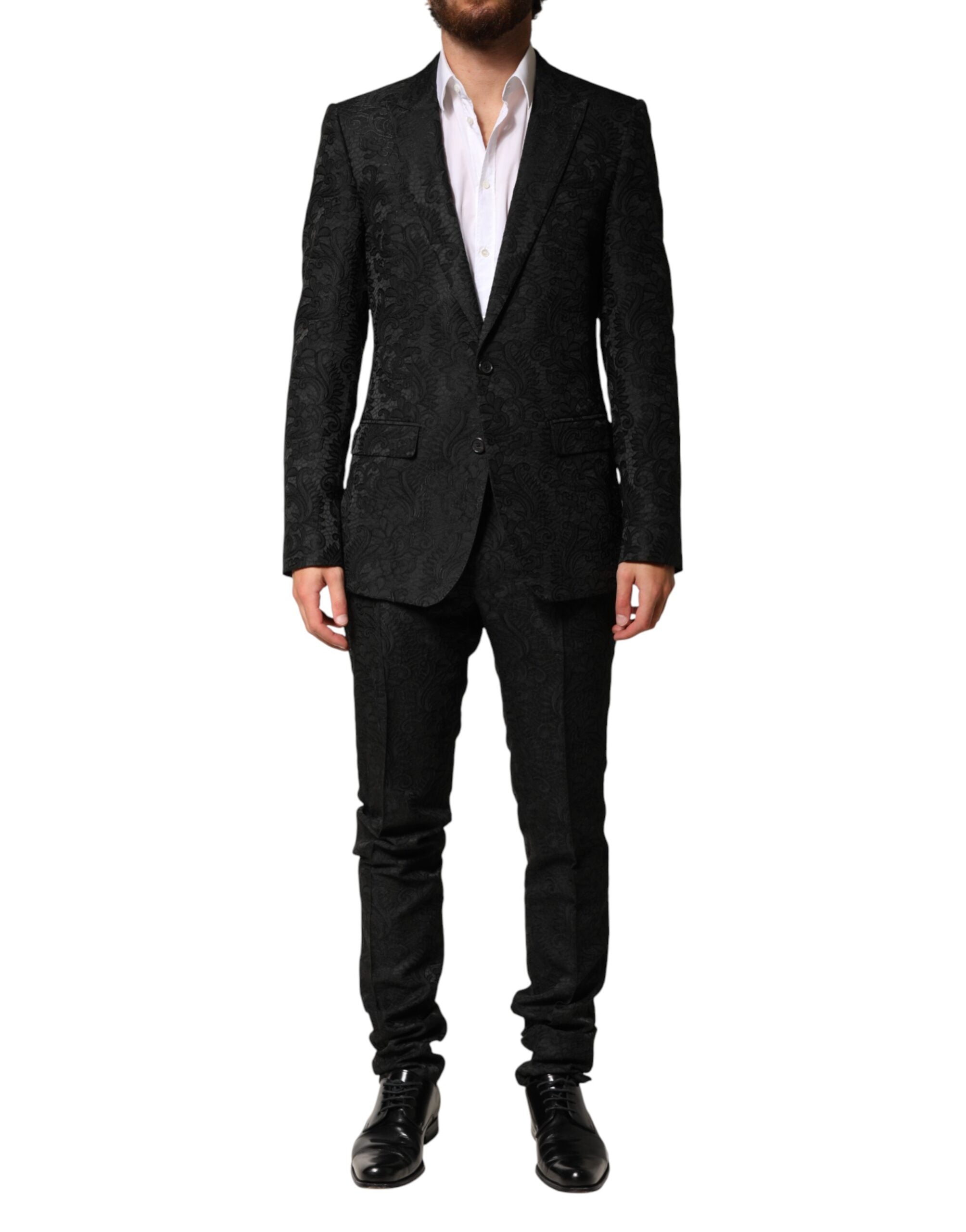 Costume homme Dolce & Gabbana en brocart noir, deux pièces, veste à double boutonnage et pantalon assorti.