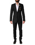 Costume homme Dolce & Gabbana noir à boutons, veste à un bouton avec embellissements et pantalon assorti, élégant et sophistiqué.