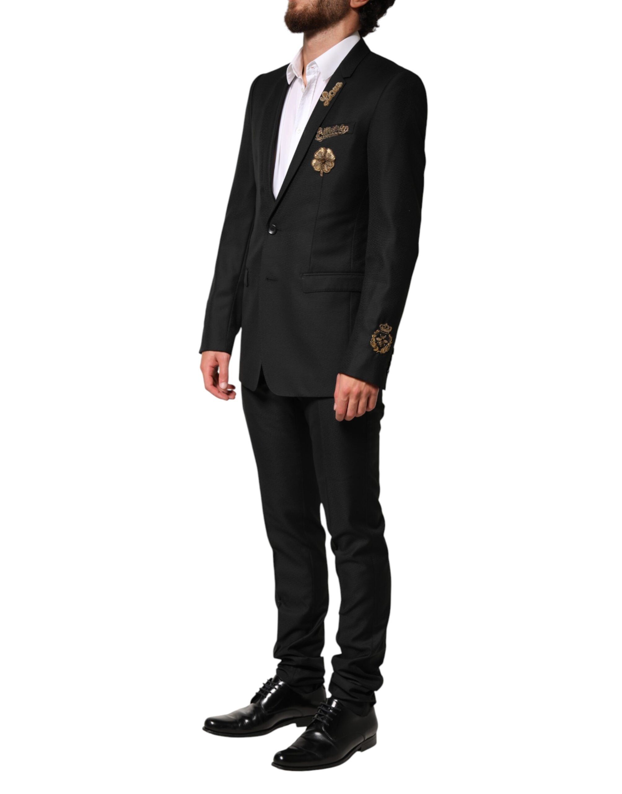 Costume noir Dolce & Gabbana à deux pièces avec embellissements, veste à simple boutonnage et pantalon assorti.