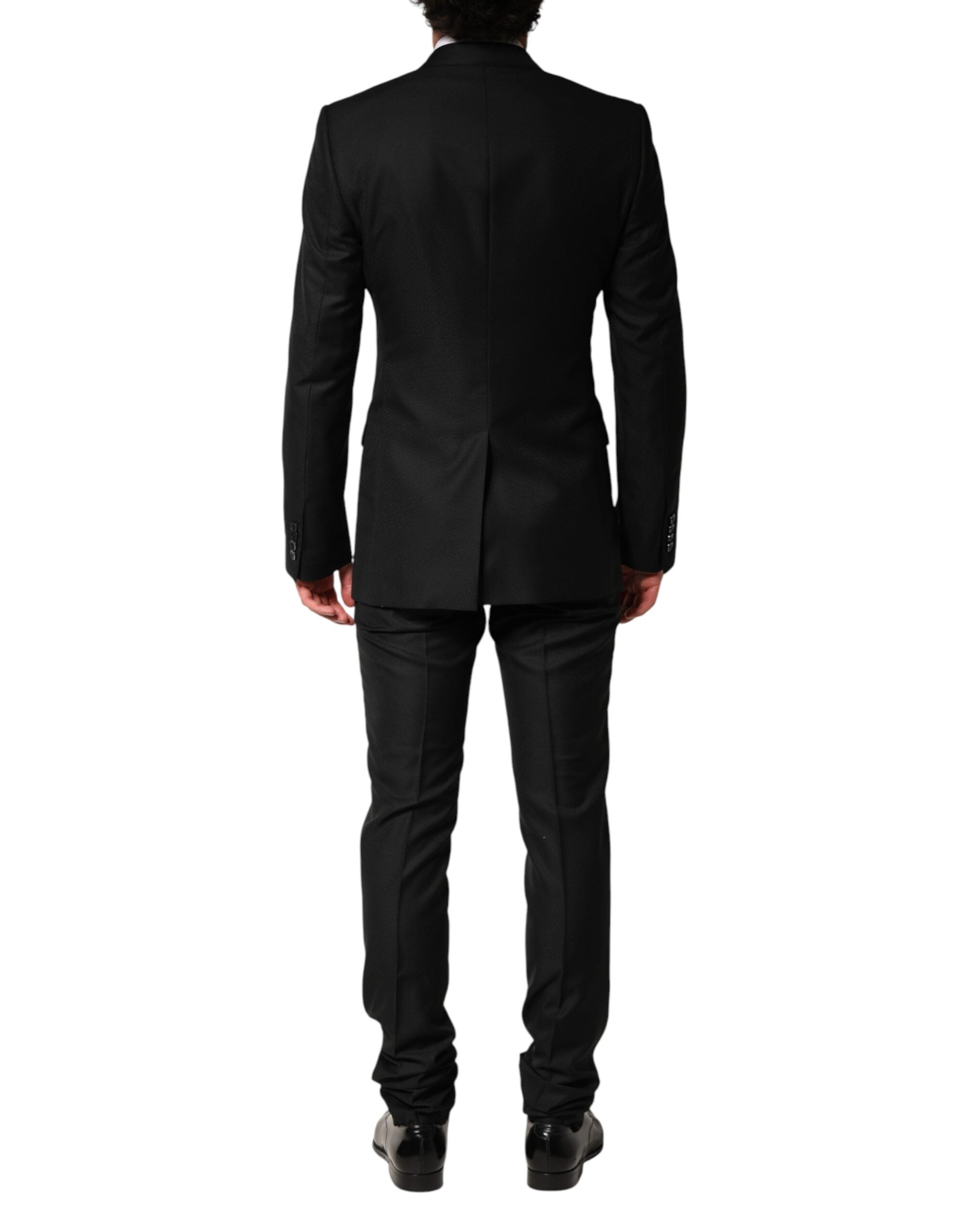 Costume noir Dolce & Gabbana à deux pièces avec embellissements, veste à boutonnière simple et pantalon assorti.