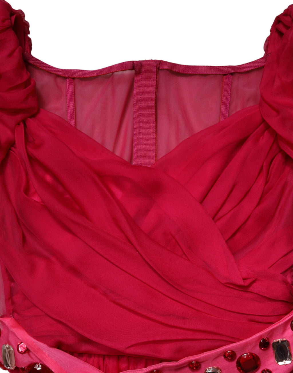 Robe midi en soie rose Dolce & Gabbana avec embellissements, coupe évasée et style élégant visible sur l'image.