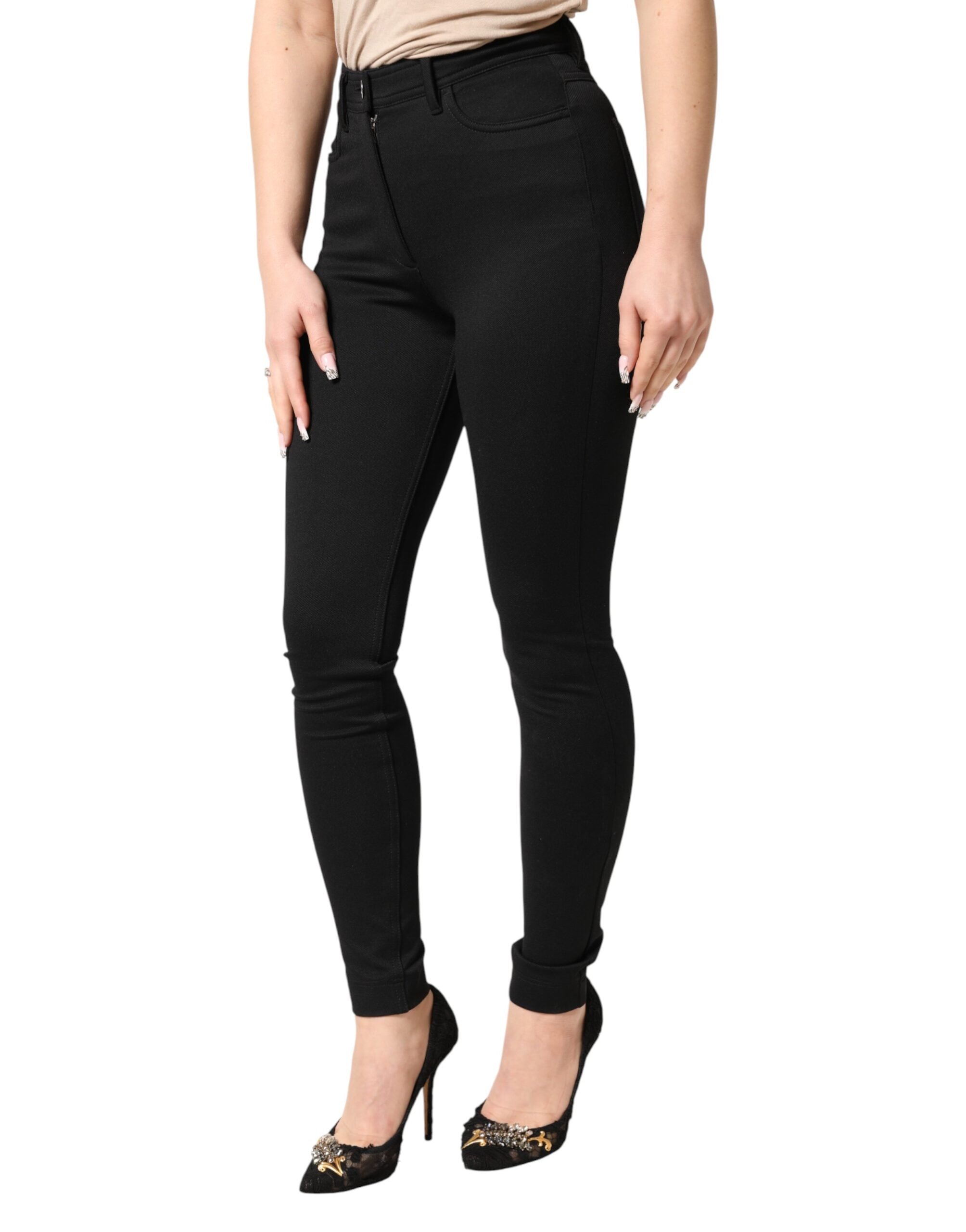 Pantalon noir en nylon extensible à taille haute de la marque Dolce & Gabbana, coupe skinny élégante.