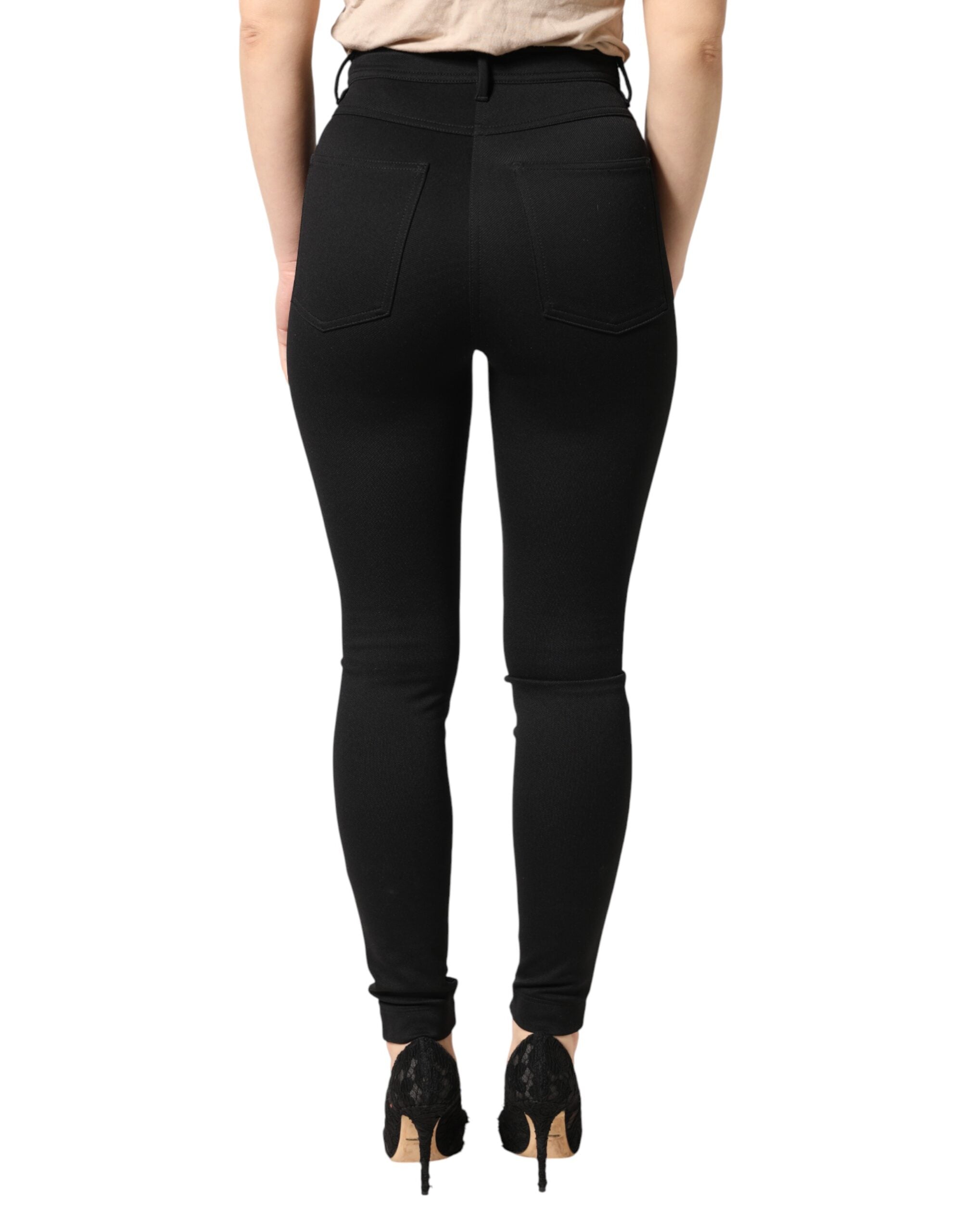Pantalon skinny noir en nylon extensible à taille haute de Dolce & Gabbana, vue de face sur fond blanc.