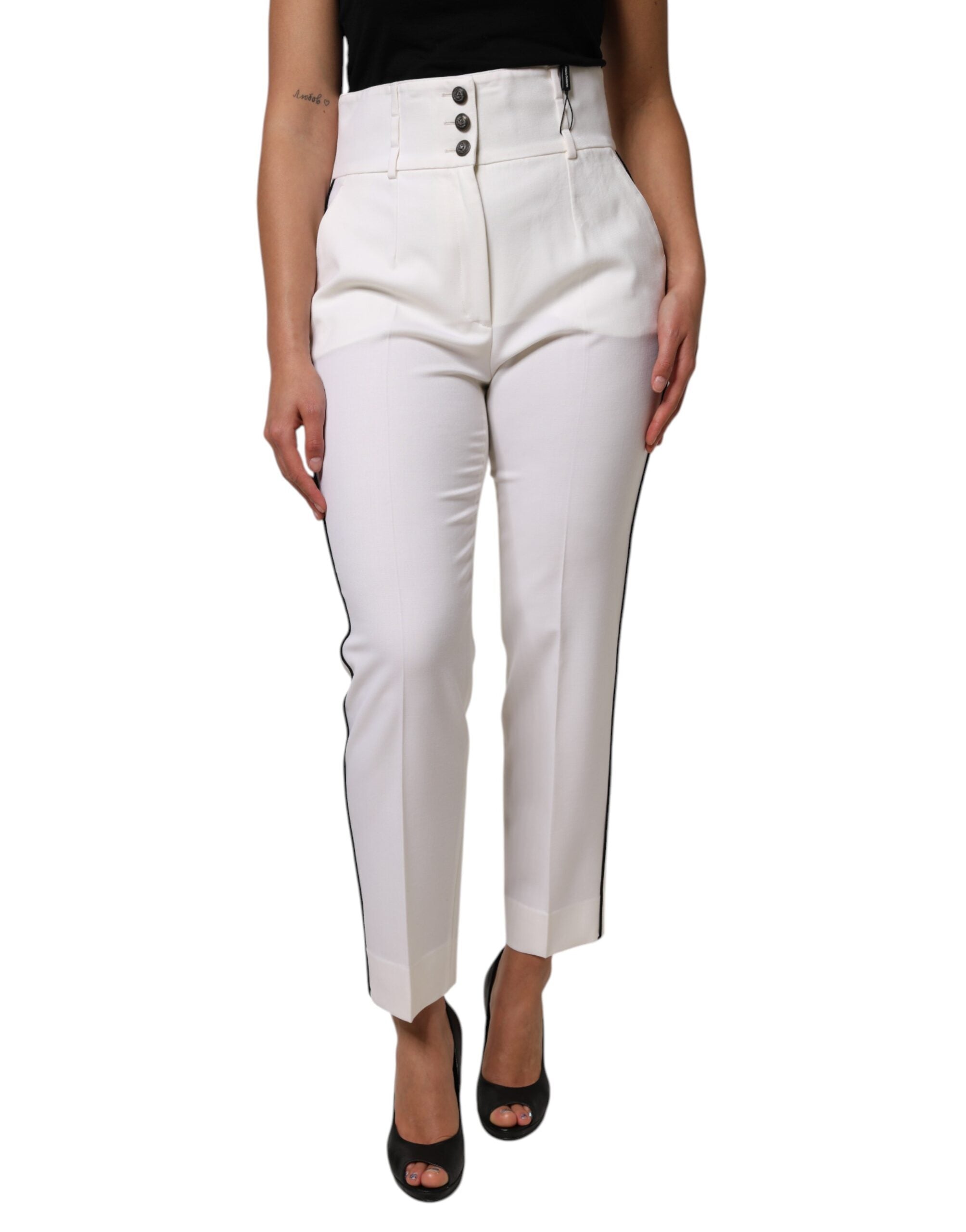Pantalon en laine blanche Dolce & Gabbana à taille haute et coupe tapered, vue de face sur un fond neutre.