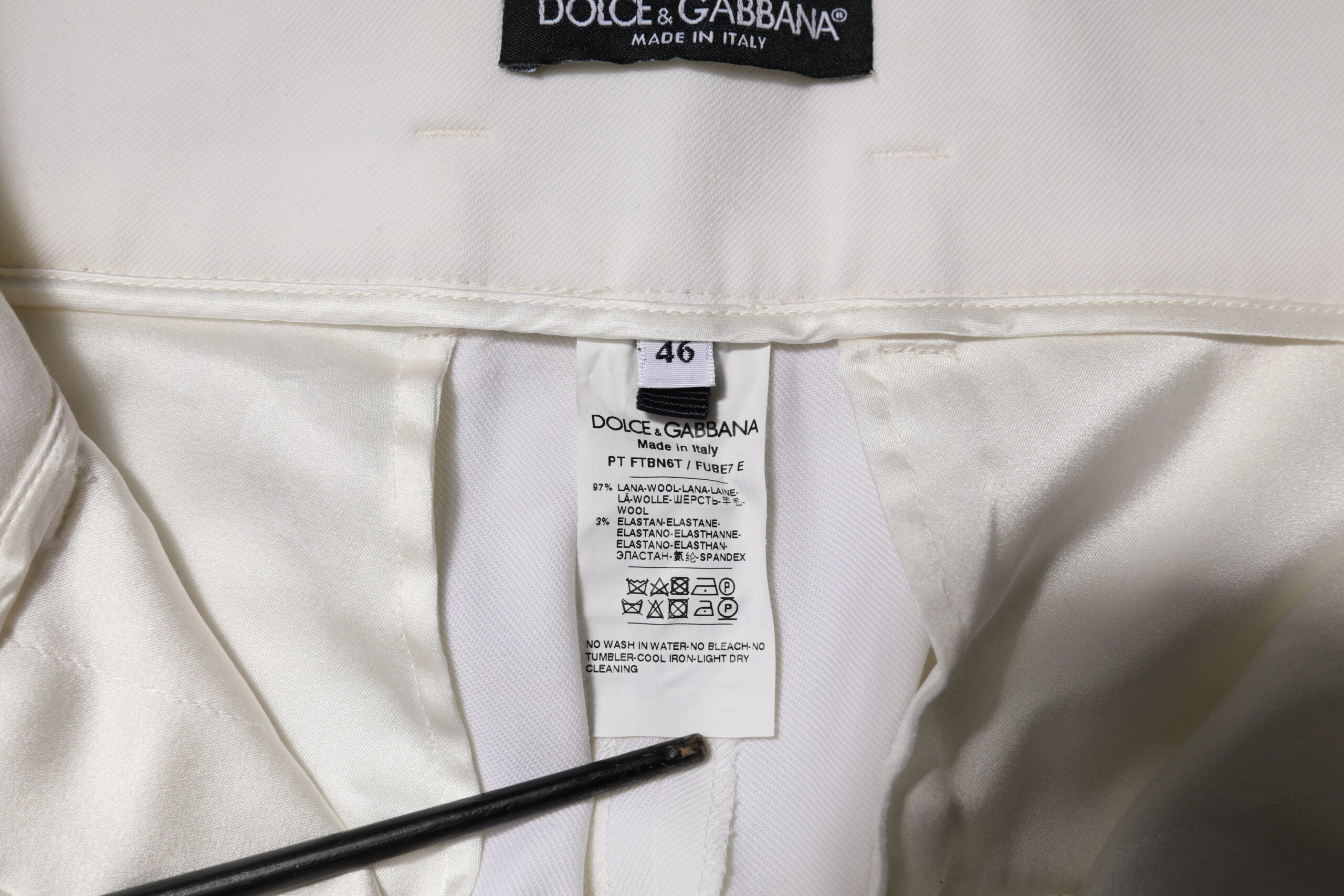 Pantalon blanc en laine Dolce & Gabbana, taille haute, coupe tapered, pour femme, vue de face.