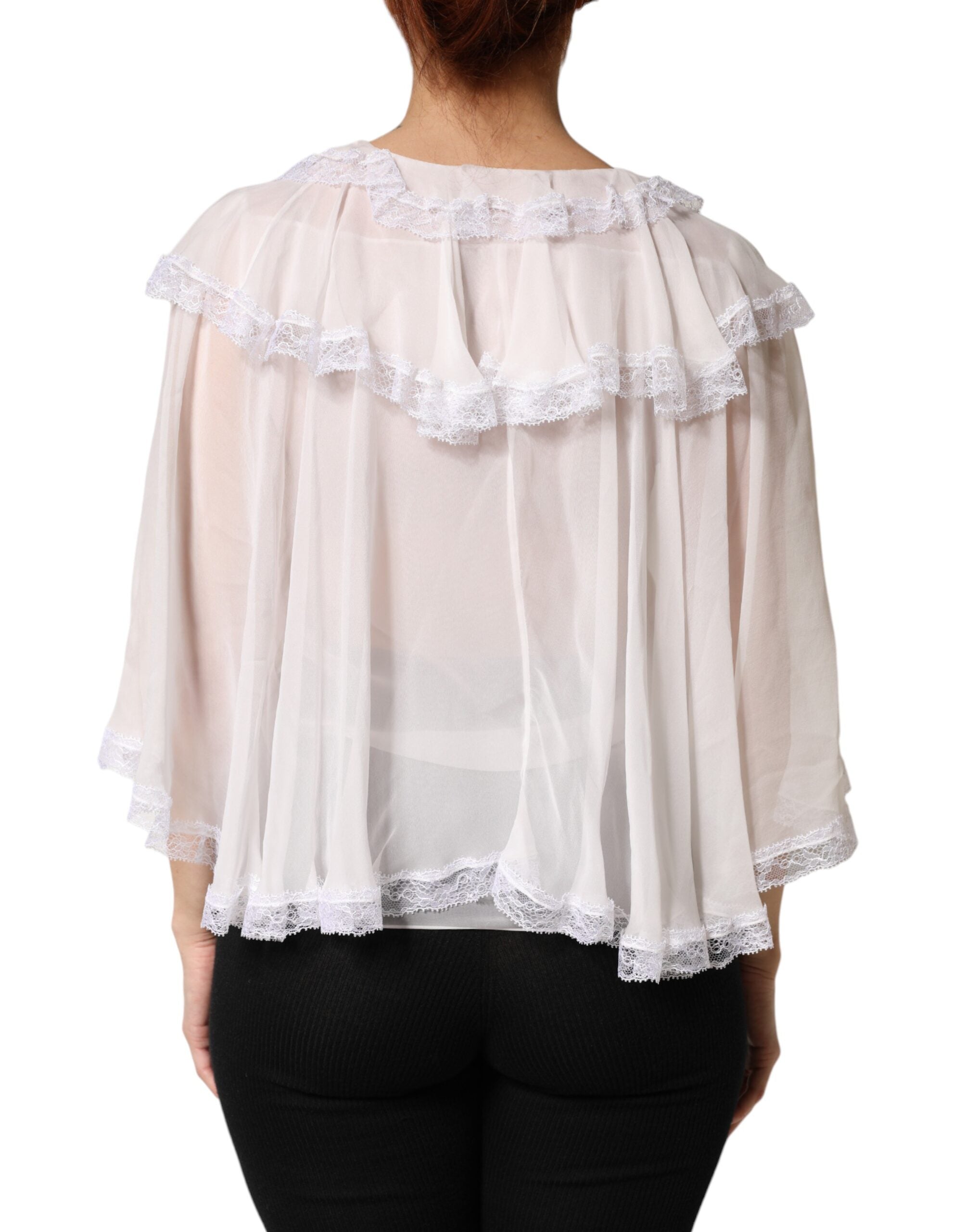 Blouse blanche à volants en dentelle à manches longues de Dolce & Gabbana, élégante et sophistiquée.
