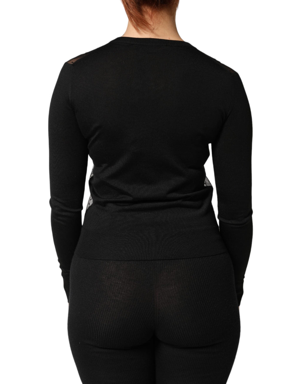 Cardigan noir transparent à boutons de Dolce & Gabbana, pull léger en maille avec détails fins.