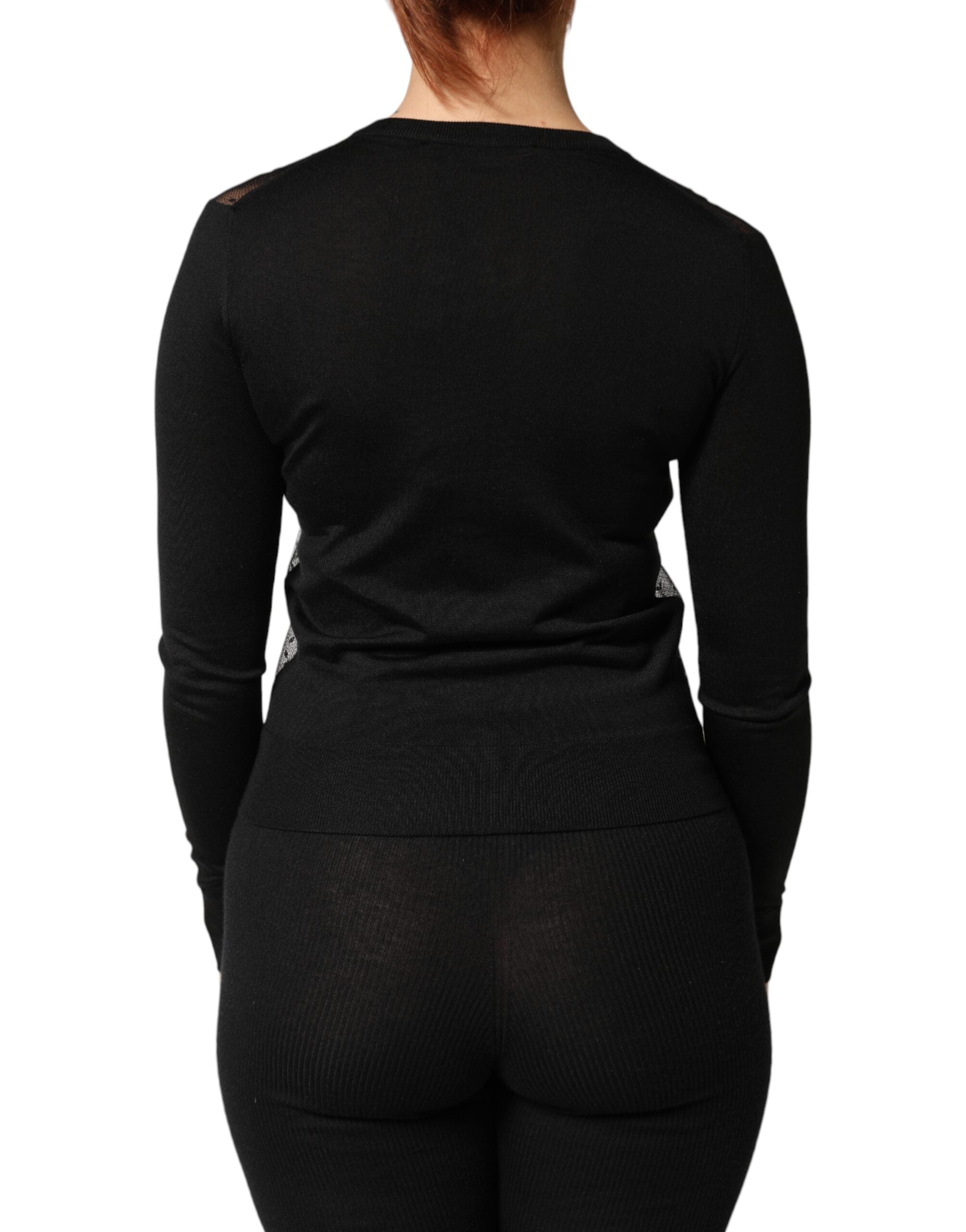 Cardigan noir transparent à boutons de Dolce & Gabbana, pull léger en maille avec détails fins.