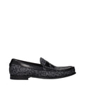 Chaussures mocassins slip-on en tissu noir de Dolce & Gabbana, élégantes et confortables pour un style sophistiqué.