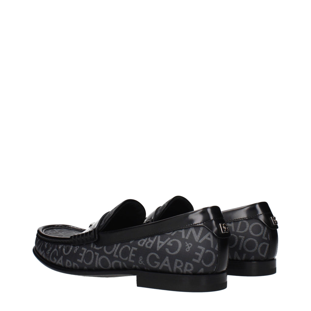 Chaussures mocassins slip-on en tissu noir de Dolce & Gabbana, élégantes et confortables pour un style sophistiqué.
