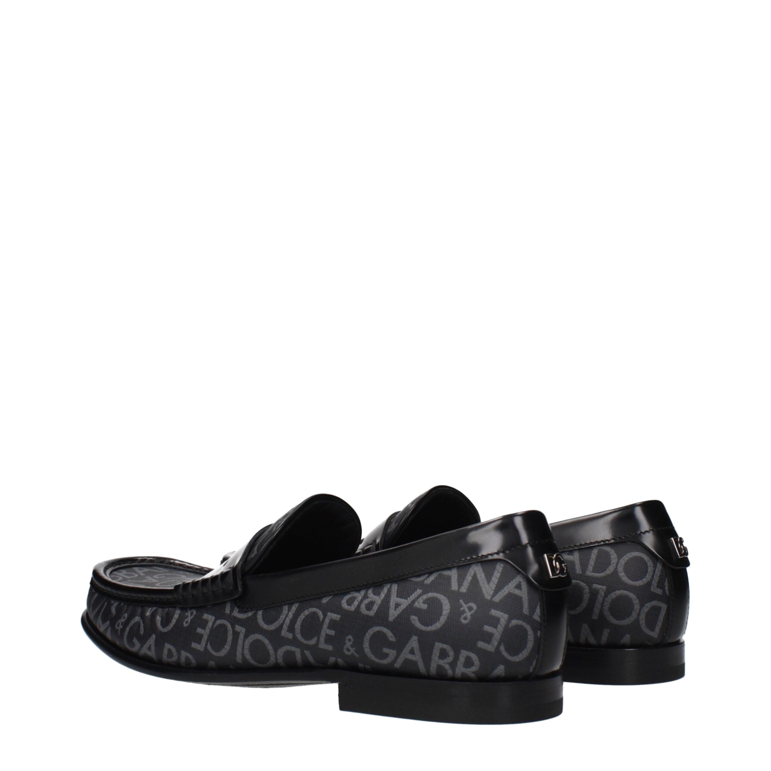 Chaussures mocassins slip-on en tissu noir de Dolce & Gabbana, élégantes et confortables pour un style sophistiqué.